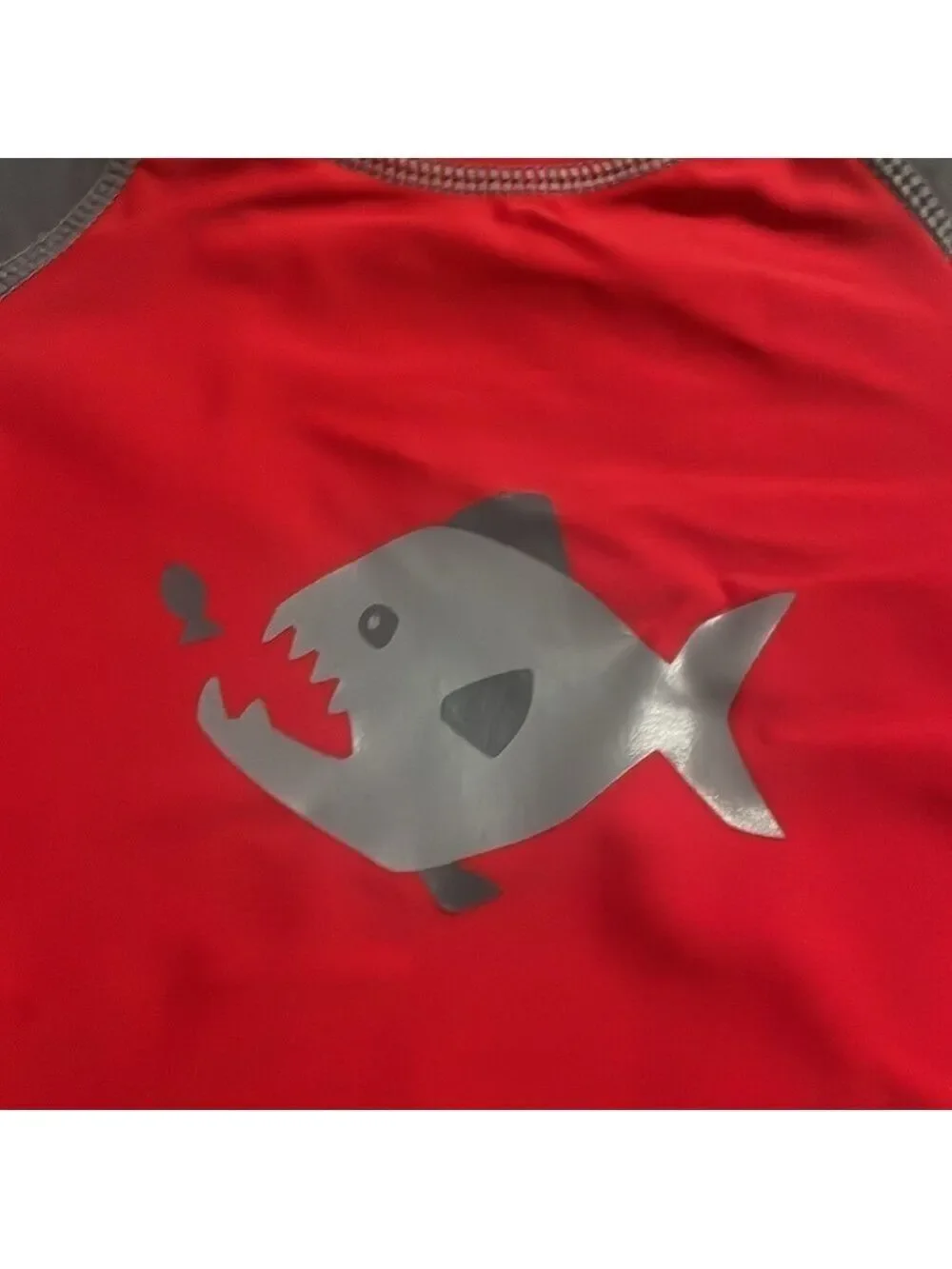 I play boys shark swim shirts and shirt size 12 months